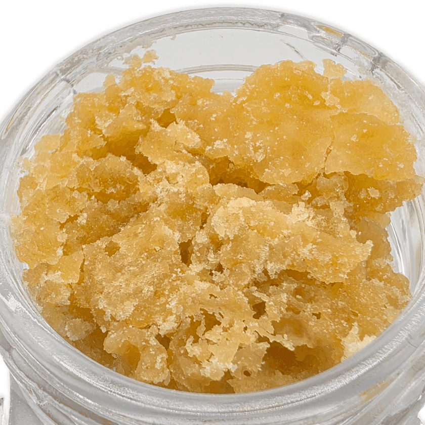 Close-up of SWEATZ live resin crumble with a golden, wet sugar texture